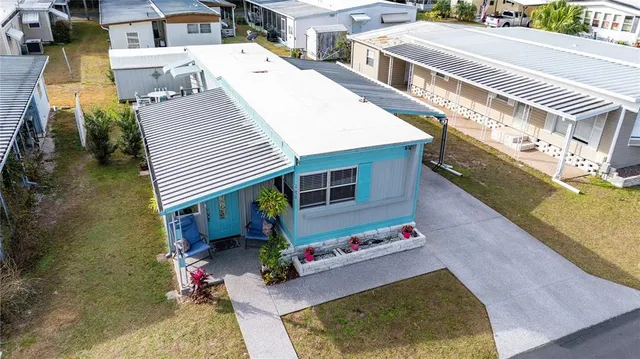 an aerial view of a house with swimming pool