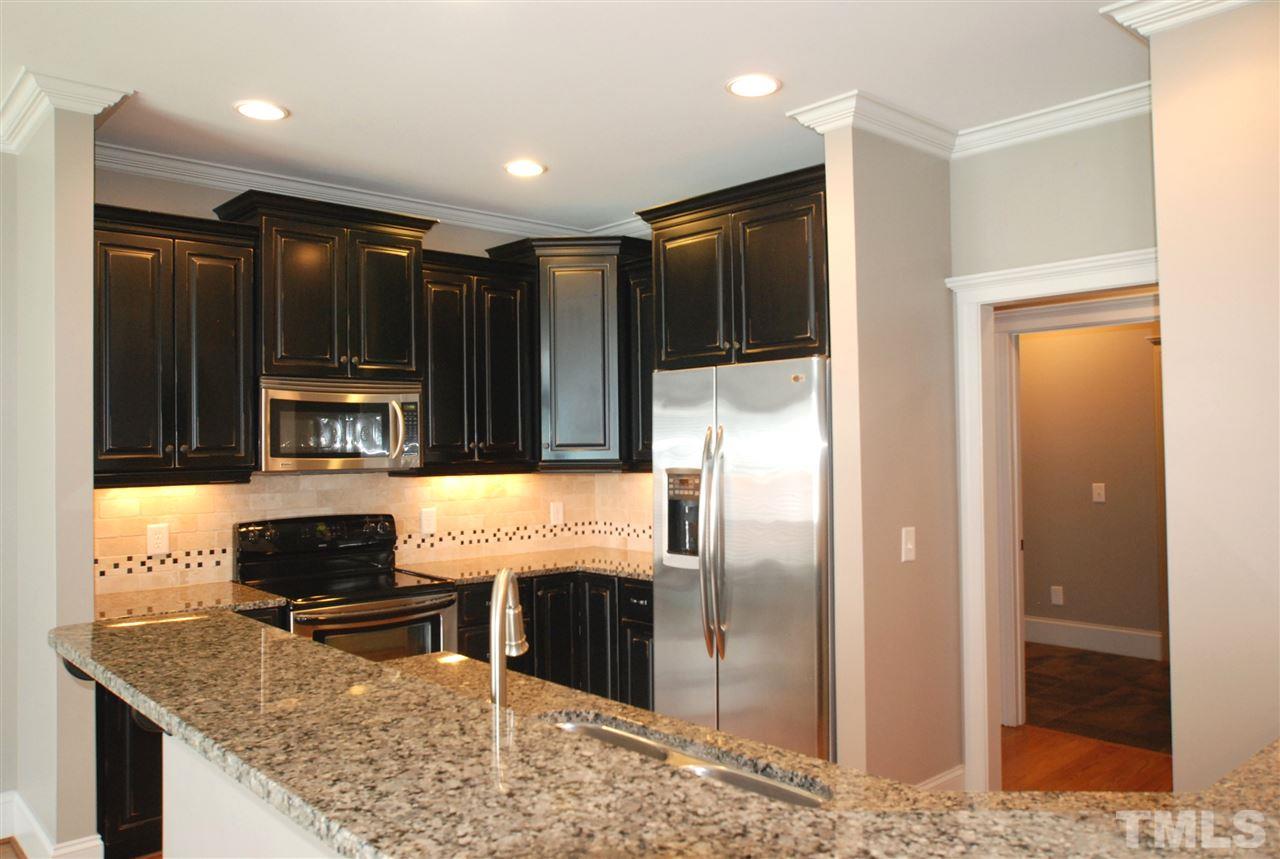 8012 Lloyd Allyns Way Raleigh, NC 27615 - Photo 11 of 25 Kitchen also has Adjustable Under Cabinet Lighting & Stainless Steel Appliances.