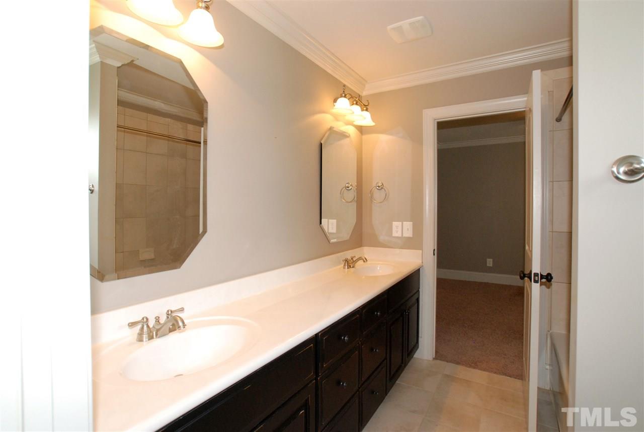 8012 Lloyd Allyns Way Raleigh, NC 27615 - Photo 21 of 25 This Bath has access to BR 2 & BR 3. Featured in this Bath is an oversized Dual Vanity & Tiled Flooring.