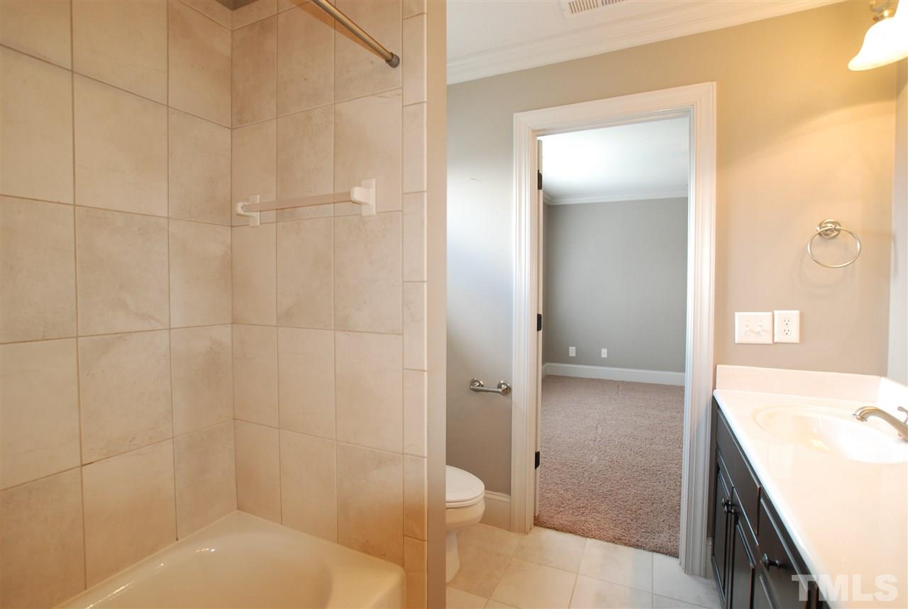 8012 Lloyd Allyns Way Raleigh, NC 27615 - Photo 22 of 25 Bath has Tiled Tub/Shower.