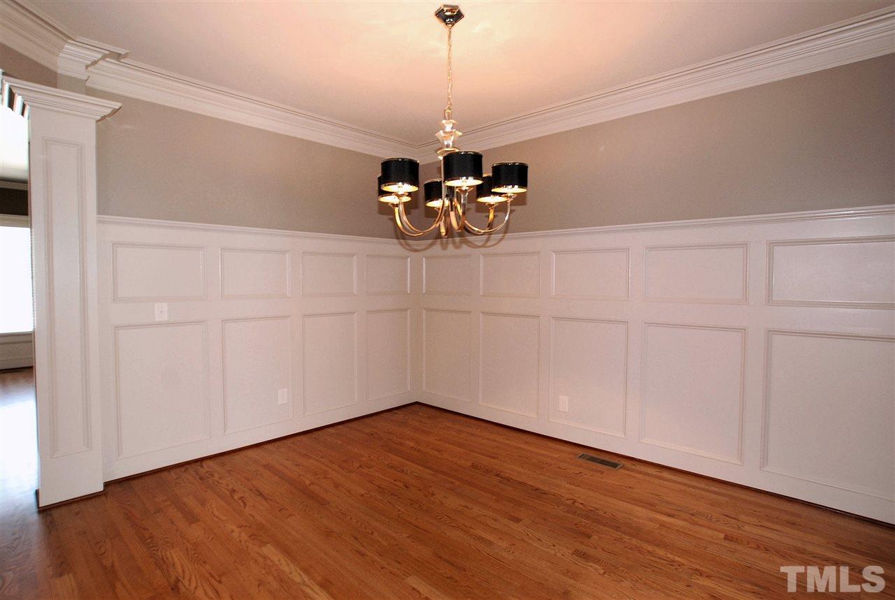 8012 Lloyd Allyns Way Raleigh, NC 27615 - Photo 4 of 25 Elegant Custom Trim & Decorative Columns makes this the perfect room for Dinner Parties.