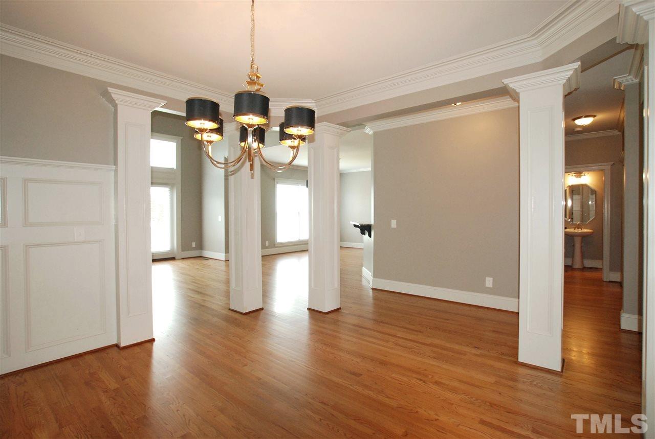 8012 Lloyd Allyns Way Raleigh, NC 27615 - Photo 5 of 25 The Formal Dining is open to the Family Room making it great for entertaining & the Decorative Columns provides the Elegance this Room deserves.