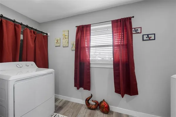 a kitchen with a sink and a refrigerator