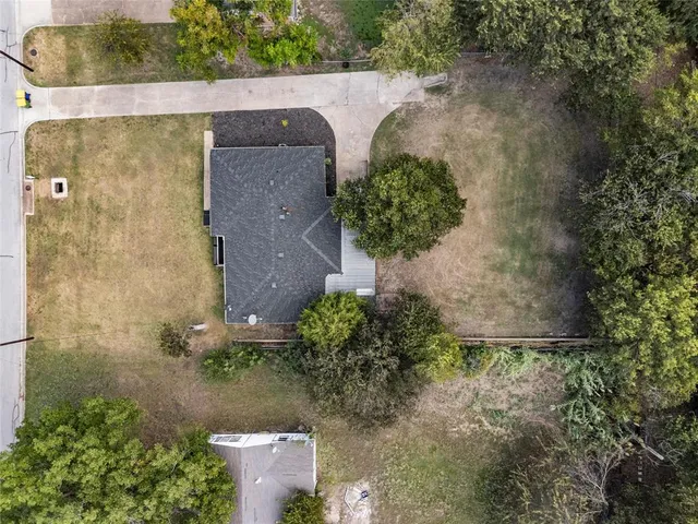 a view of empty room with wooden walls
