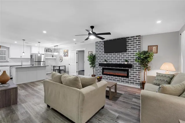 a living room with furniture and a fireplace