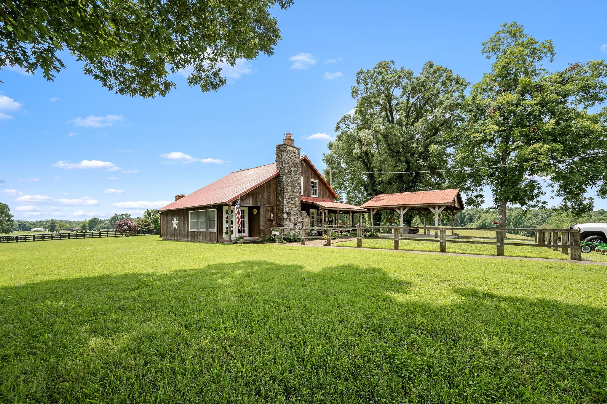 540 Powell Hollow Road Tullahoma, TN 37388 - Photo 11 of 99 a front view of a house with a yard and trees