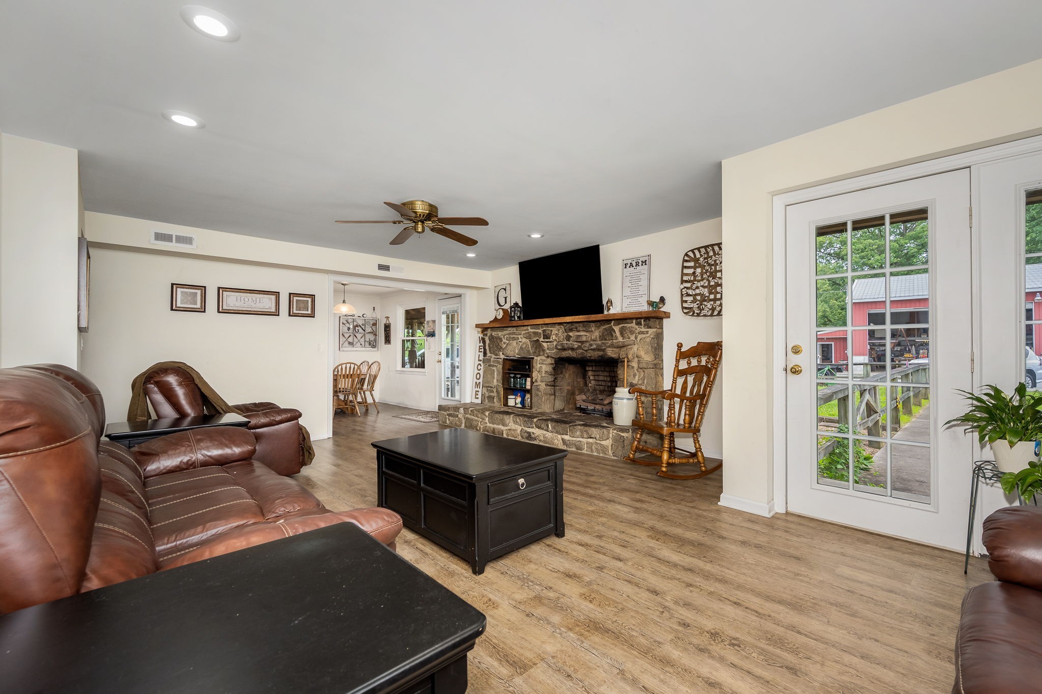 540 Powell Hollow Road Tullahoma, TN 37388 - Photo 15 of 99 a living room with furniture a fireplace and a flat screen tv