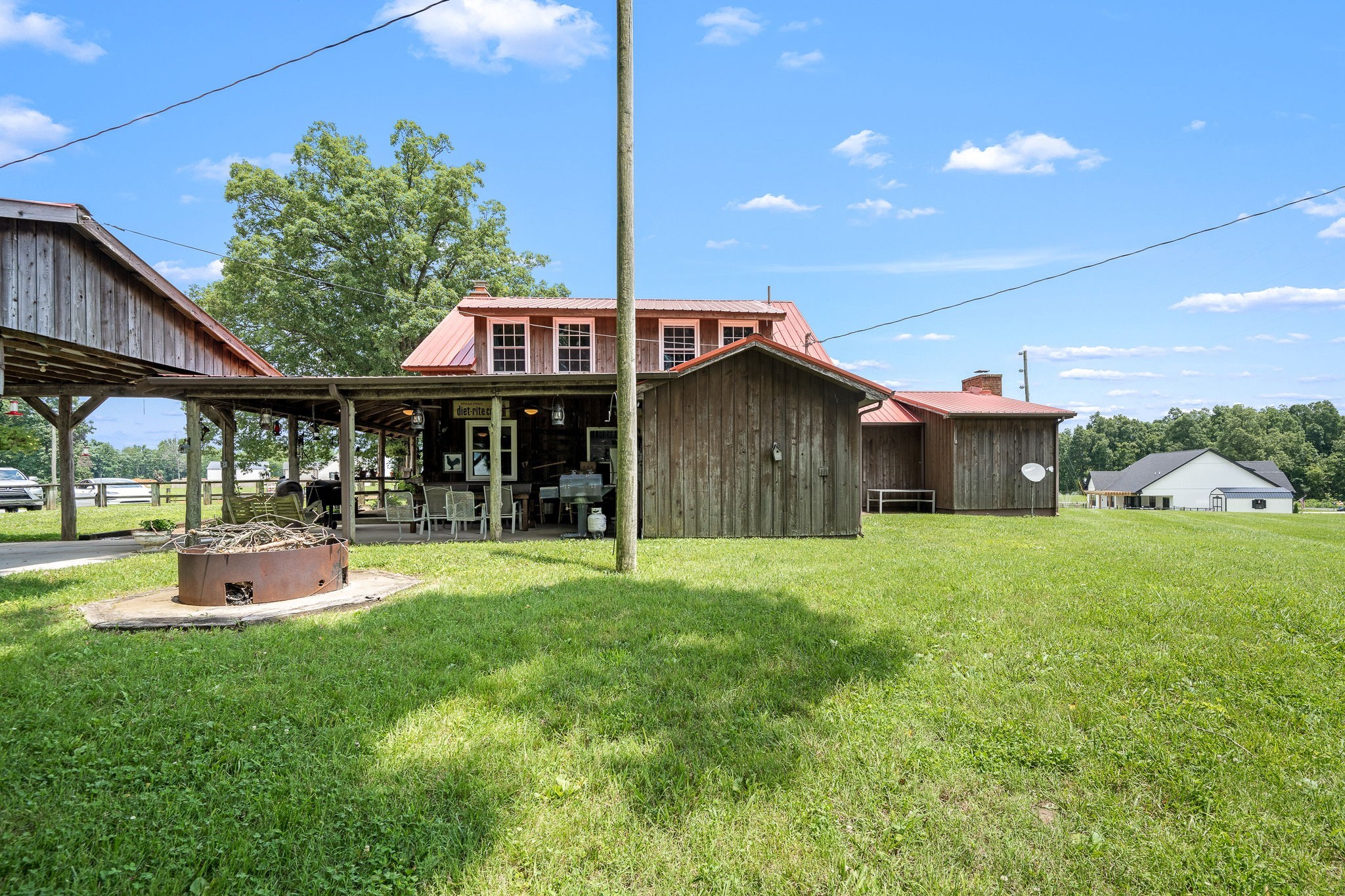 540 Powell Hollow Road Tullahoma, TN 37388 - Photo 54 of 99 a front view of a house with a yard table and chairs