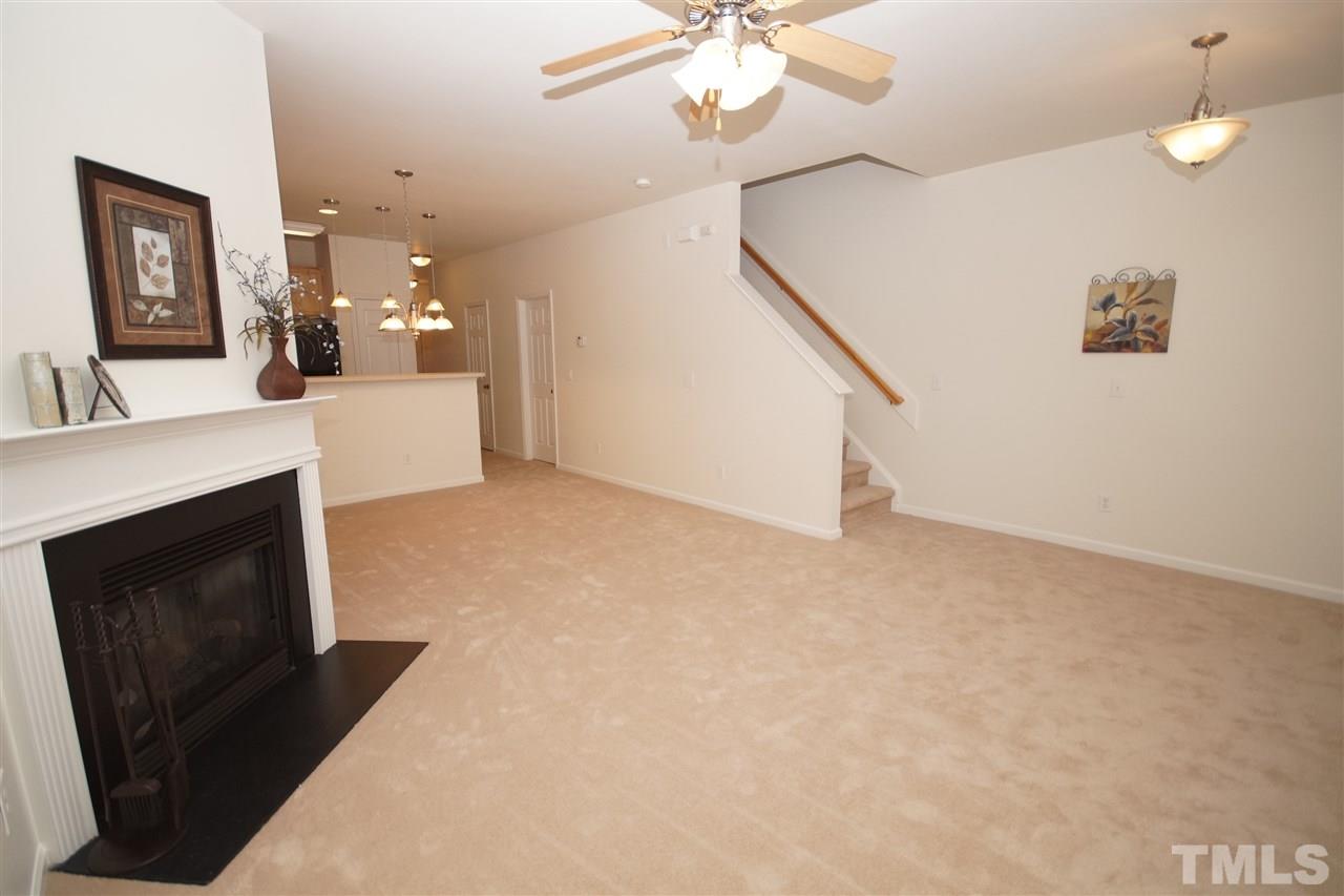 8235 Belneath Court Raleigh, NC 27613 - Photo 4 of 17 a view of a hallway with fireplace and entryway