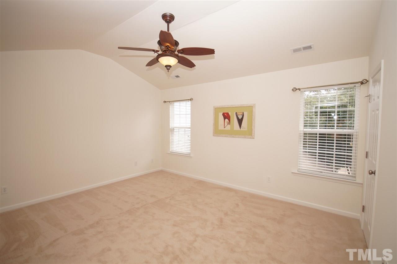 8235 Belneath Court Raleigh, NC 27613 - Photo 10 of 17 a view of a livingroom with a ceiling fan and window