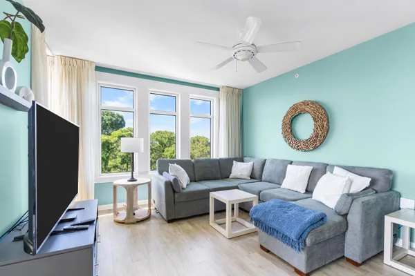 a living room with furniture and a large window