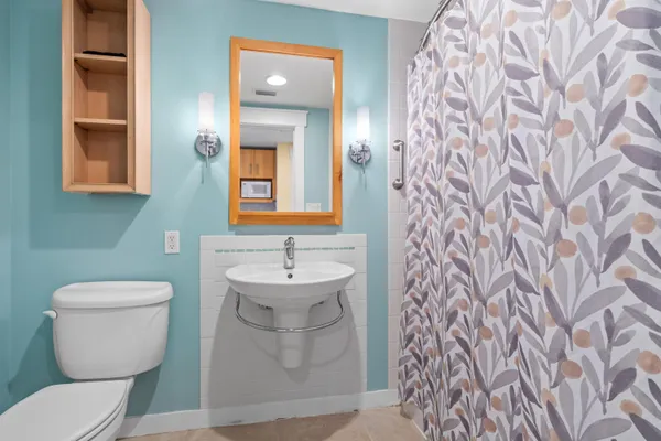 a bathroom with a toilet and a sink