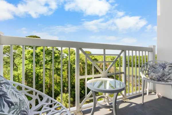 a view of a balcony furniture and bedroom