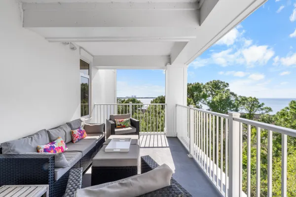a view of a living room and balcony