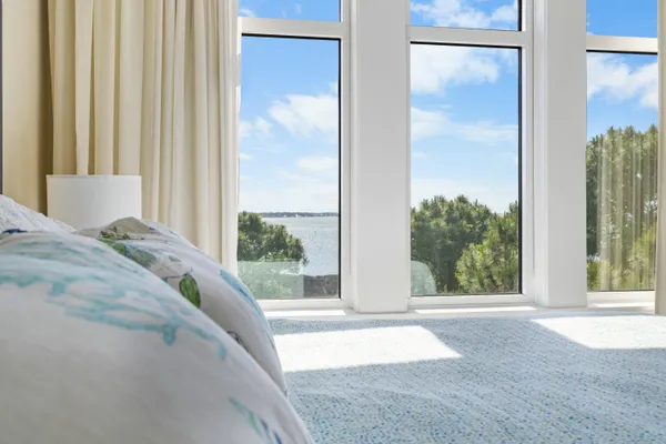 a view of a bedroom next to a window