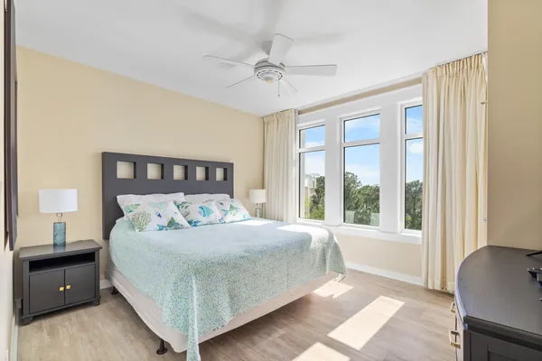 a bedroom with a large bed and a window