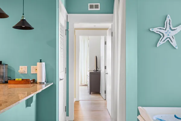 a view of a kitchen from the hallway