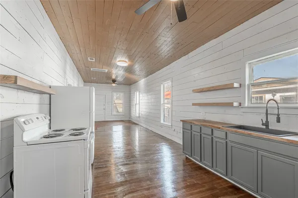 a view of a kitchen with sink and dishwasher