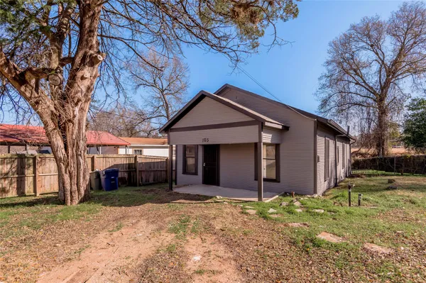 a front view of house with a yard and garage