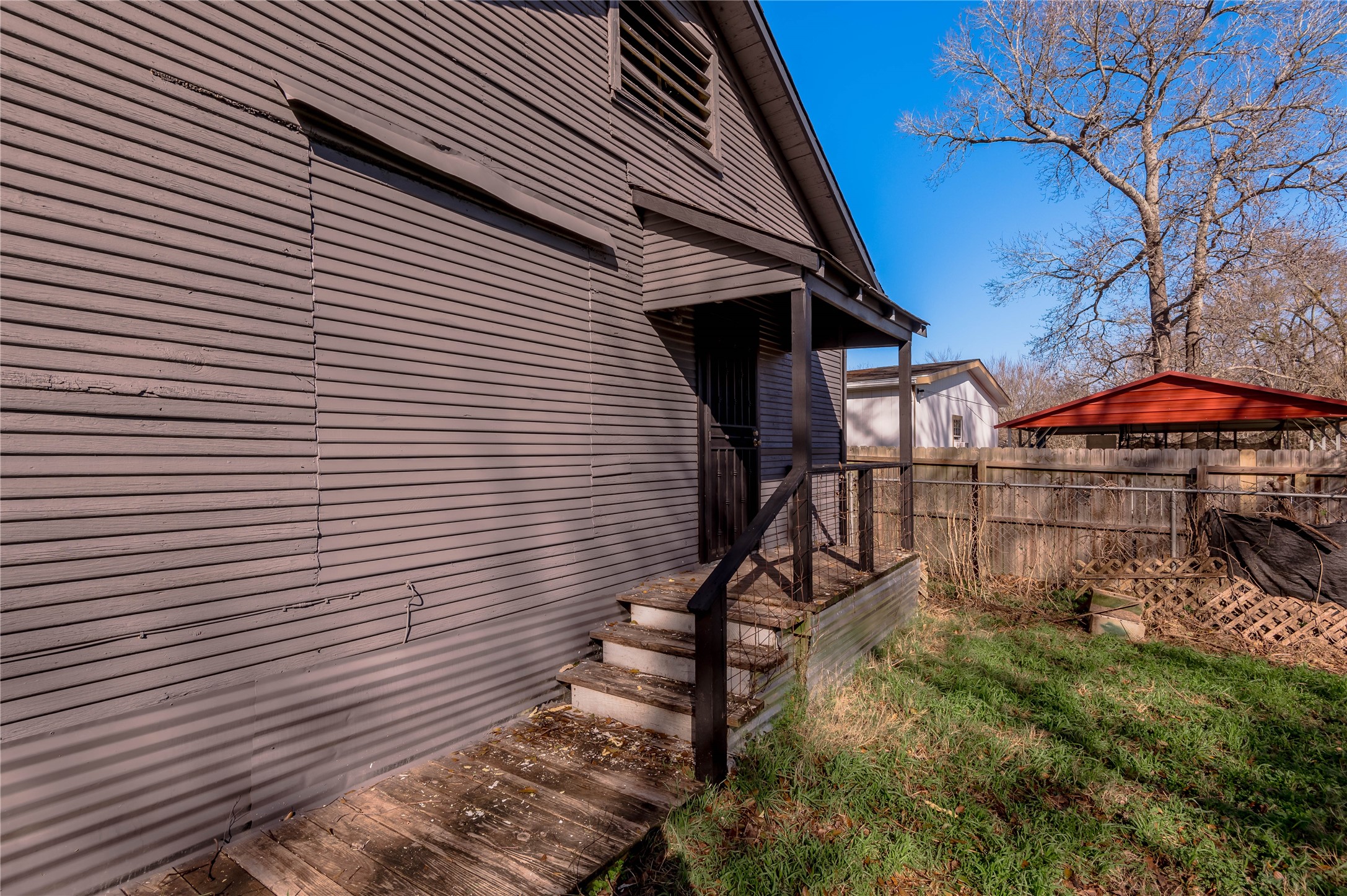 703 Avenue J Huntsville, TX 77320 - Photo 25 of 26 a view of a house with a yard