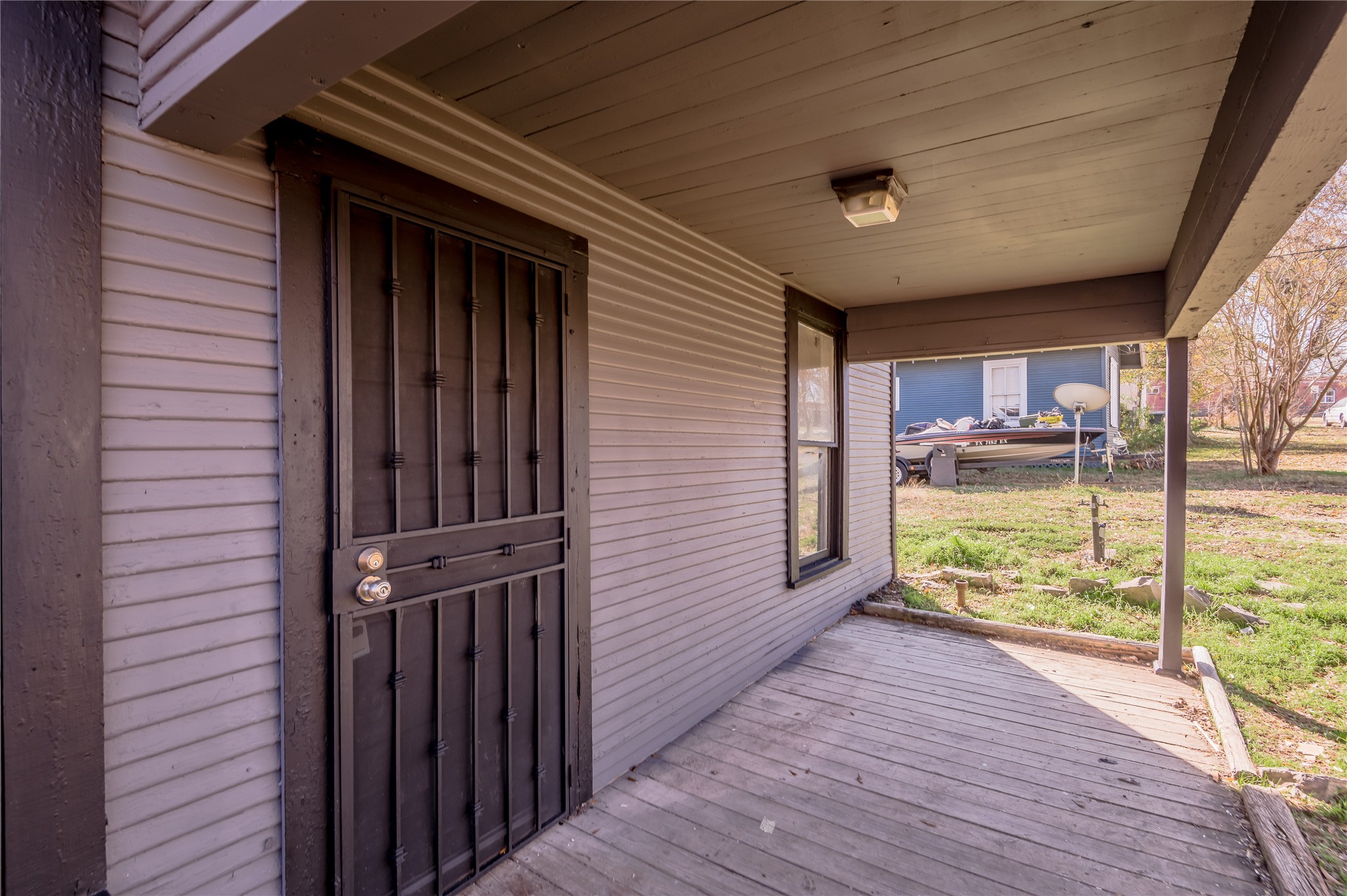 703 Avenue J Huntsville, TX 77320 - Photo 3 of 26 a view of a porch with wooden floor