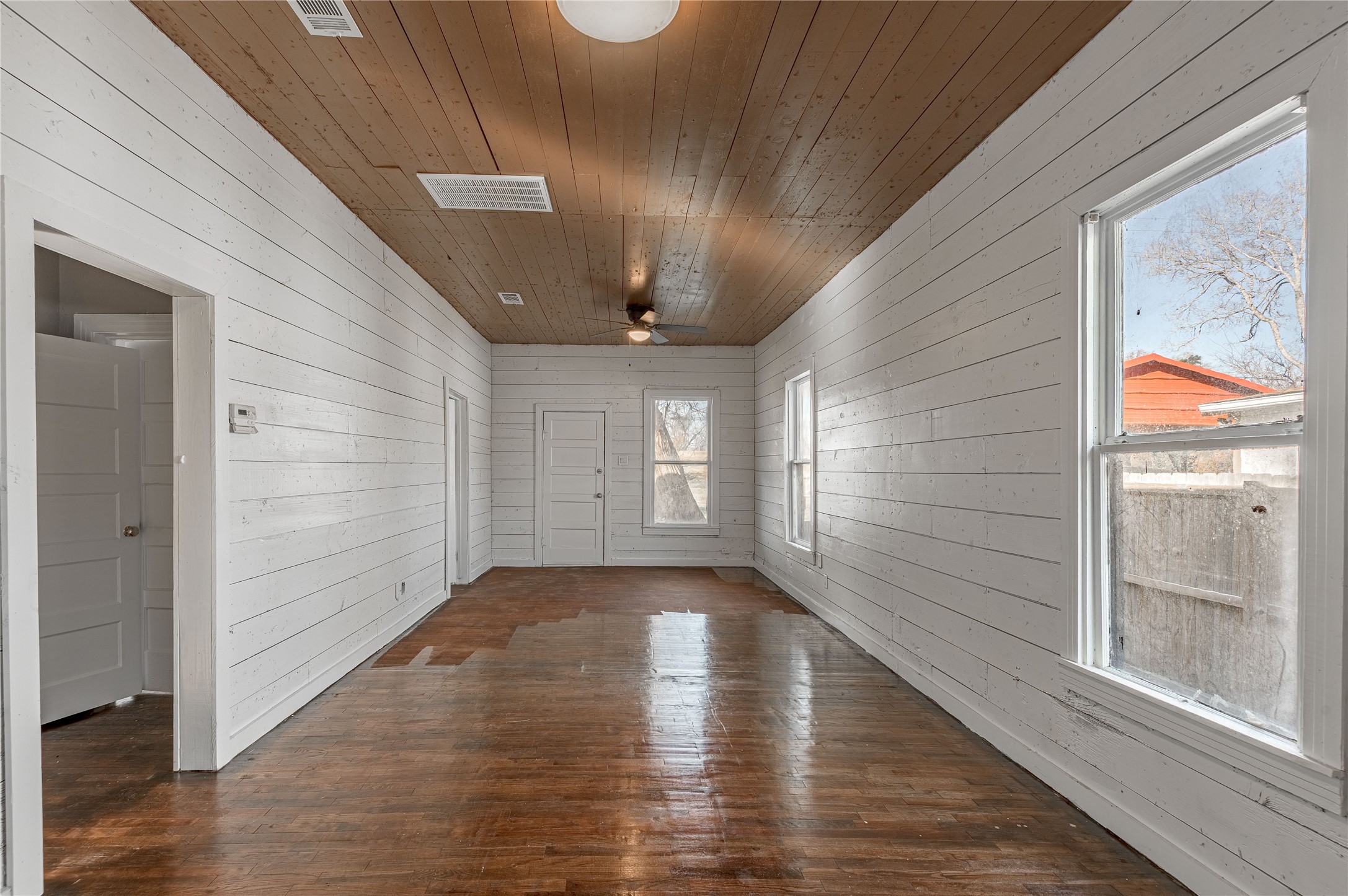 703 Avenue J Huntsville, TX 77320 - Photo 7 of 26 a view of gallery with wooden floor