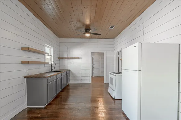 a kitchen with stainless steel appliances a refrigerator and a sink