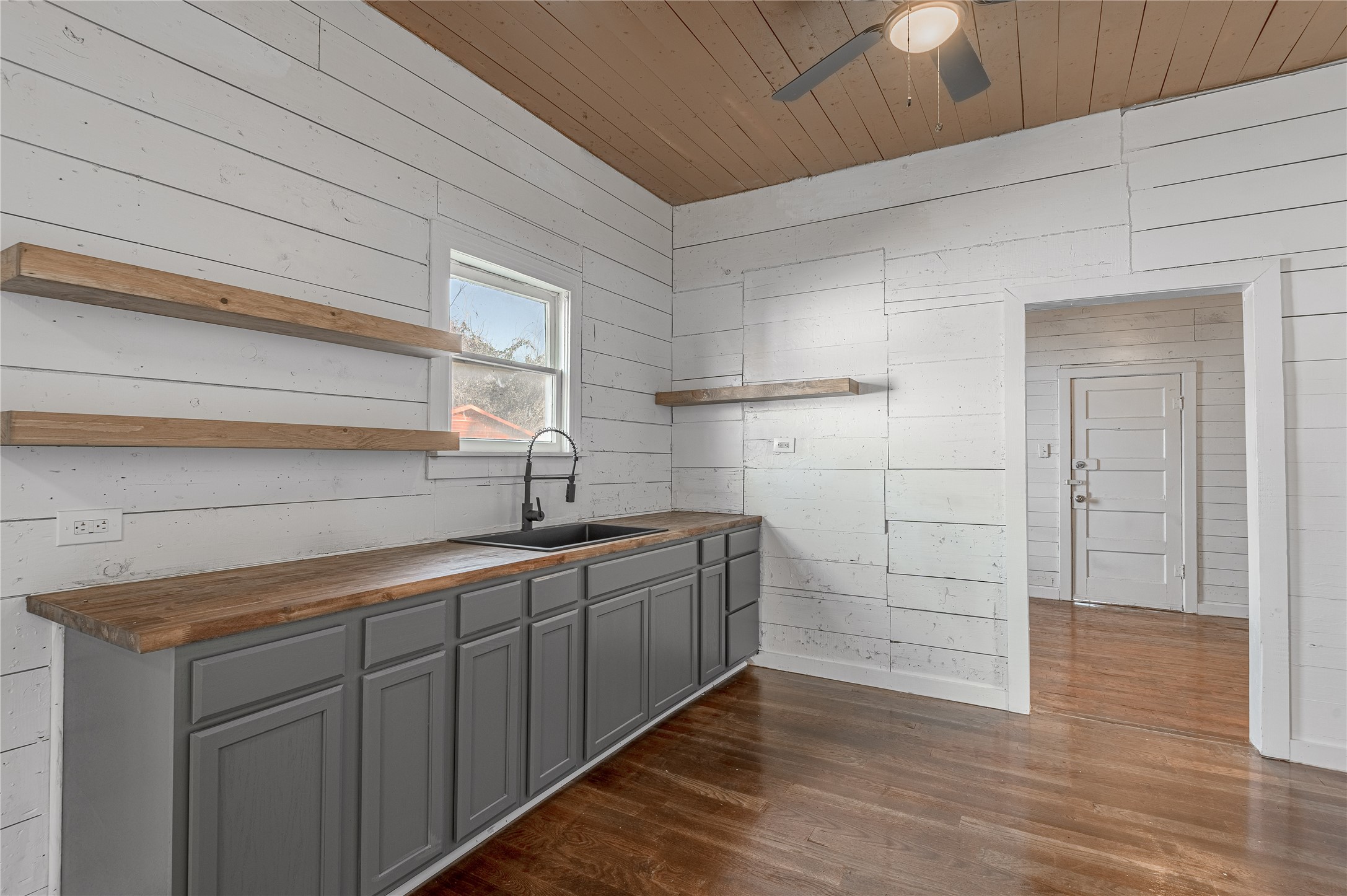 703 Avenue J Huntsville, TX 77320 - Photo 9 of 26 a view of a sink and dishwasher in a kitchen