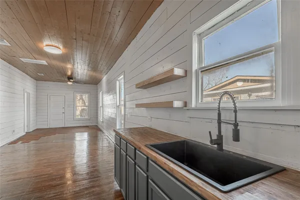 a kitchen with a sink and cabinets