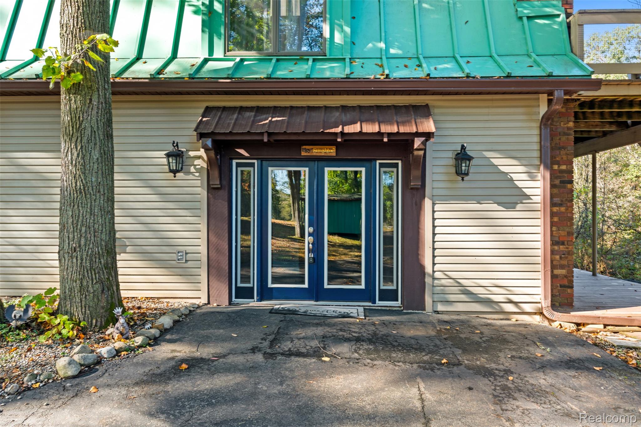 7670 Mi State Road Manchester, MI 48158 - Photo 4 of 53 Entrance to property featuring french doors, a metal roof, and a standing seam roof