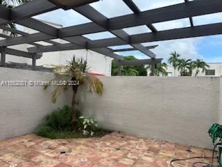 4716 Southwest 67th Avenue, Unit D2 Miami, FL 33155 - Photo 2 of 10 a view of a garage