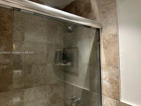 4716 Southwest 67th Avenue, Unit D2 Miami, FL 33155 - Photo 8 of 10 a bathroom with a shower