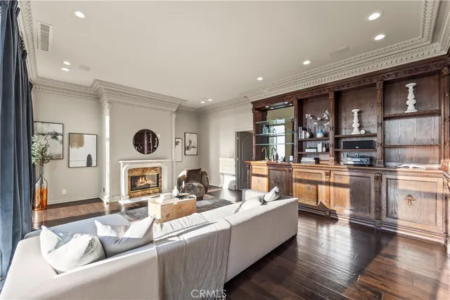 a living room with stainless steel appliances kitchen island granite countertop furniture and a kitchen view
