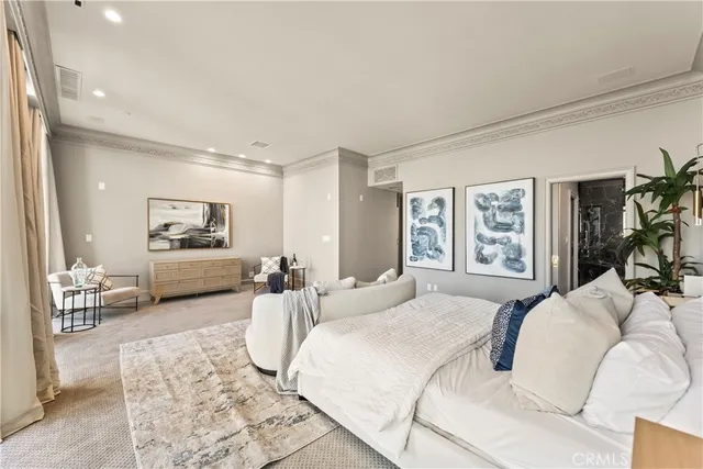 a bedroom with a bed and a couch