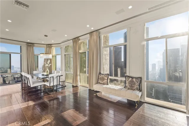 a living room with furniture and large glass door