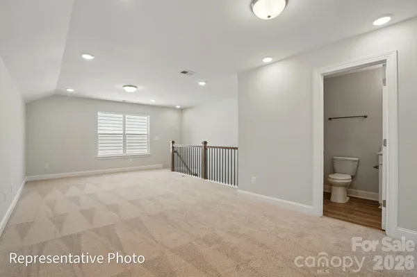 a view of an empty room with a bathroom