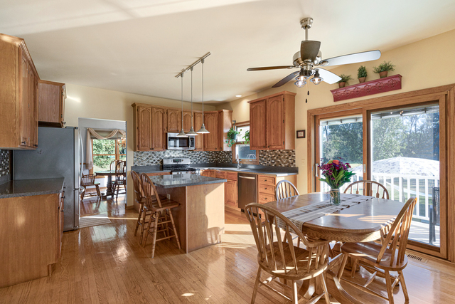 14N600 Timber Ridge Drive Elgin, IL 60124 - Photo 15 of 28 a view of a dining room with furniture window and wooden floor