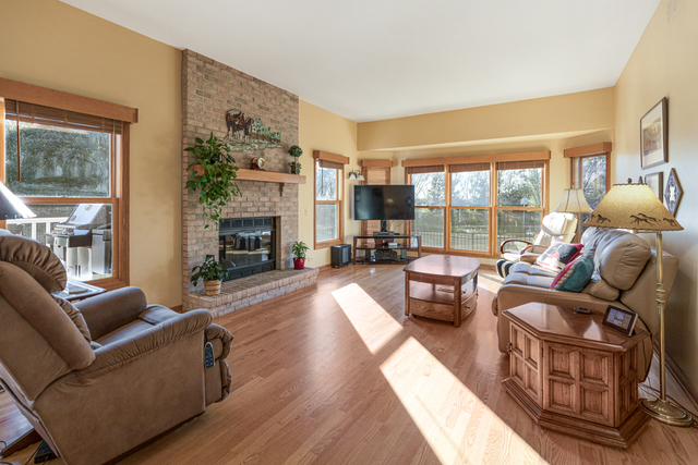 14N600 Timber Ridge Drive Elgin, IL 60124 - Photo 18 of 28 a living room with fireplace furniture and a large window