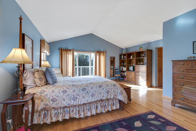 14N600 Timber Ridge Drive Elgin, IL 60124 - Photo 19 of 28 a bedroom with a large bed and a large window