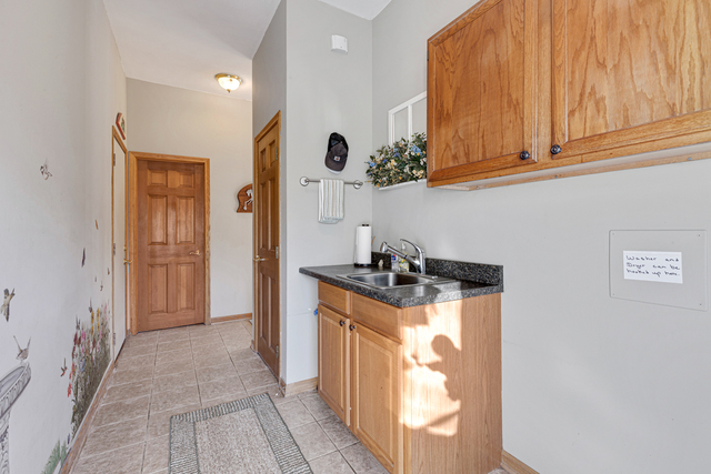 14N600 Timber Ridge Drive Elgin, IL 60124 - Photo 28 of 28 a kitchen with stainless steel appliances granite countertop a stove and a sink