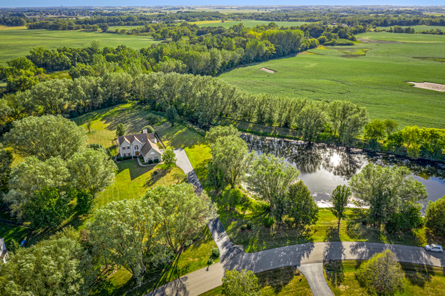 14N600 Timber Ridge Drive Elgin, IL 60124 - Photo 8 of 28 a view of a lake with a houses yard