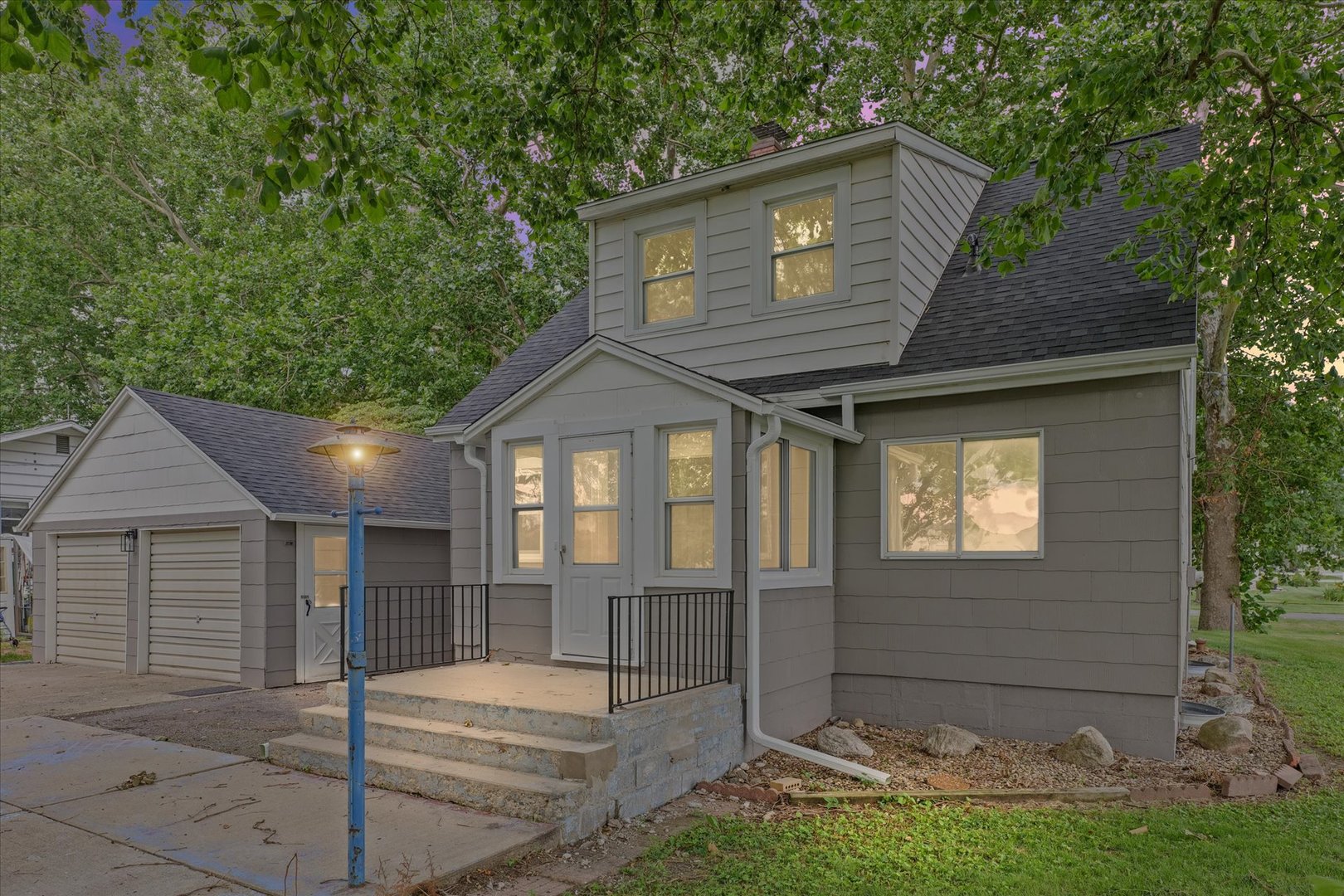 105 Madison Street Sibley, IL 61773 - Photo 1 of 22 a front view of a house with a yard