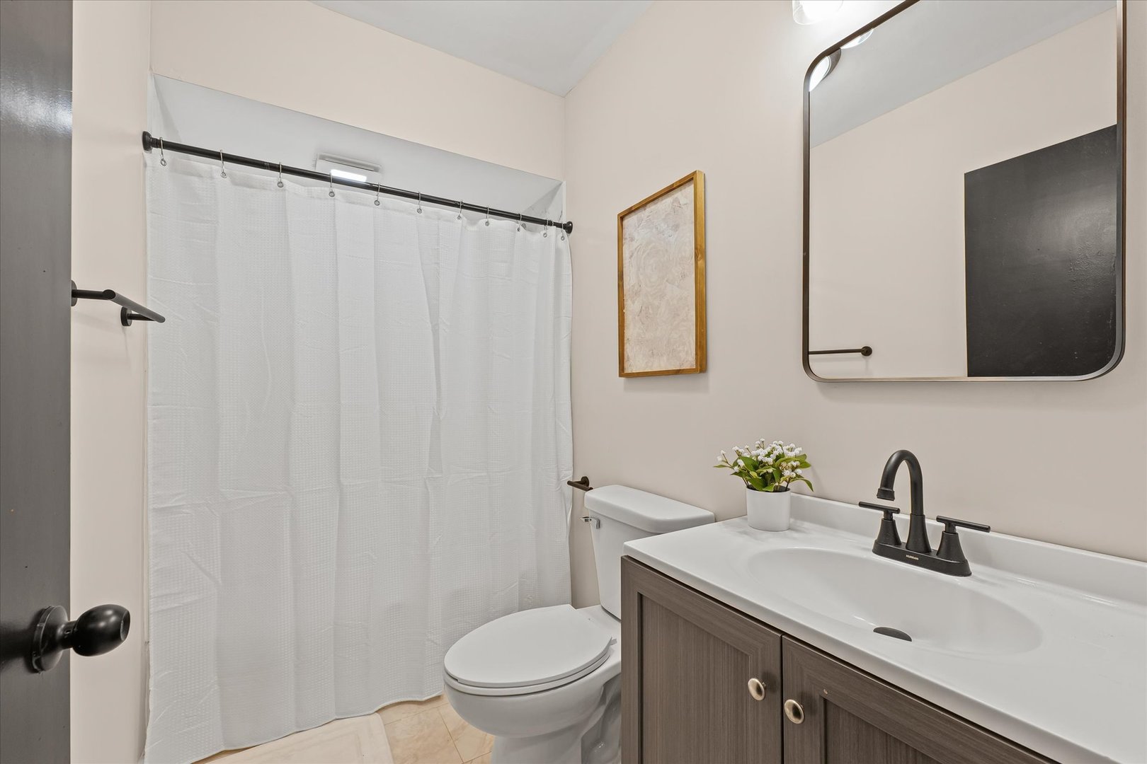 105 Madison Street Sibley, IL 61773 - Photo 13 of 22 a bathroom with a sink a toilet and shower