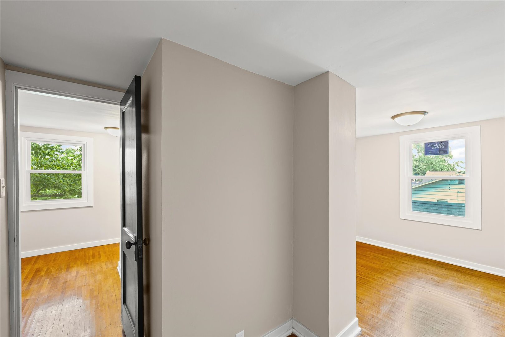 105 Madison Street Sibley, IL 61773 - Photo 16 of 22 a view of an empty room with a window and a mirror