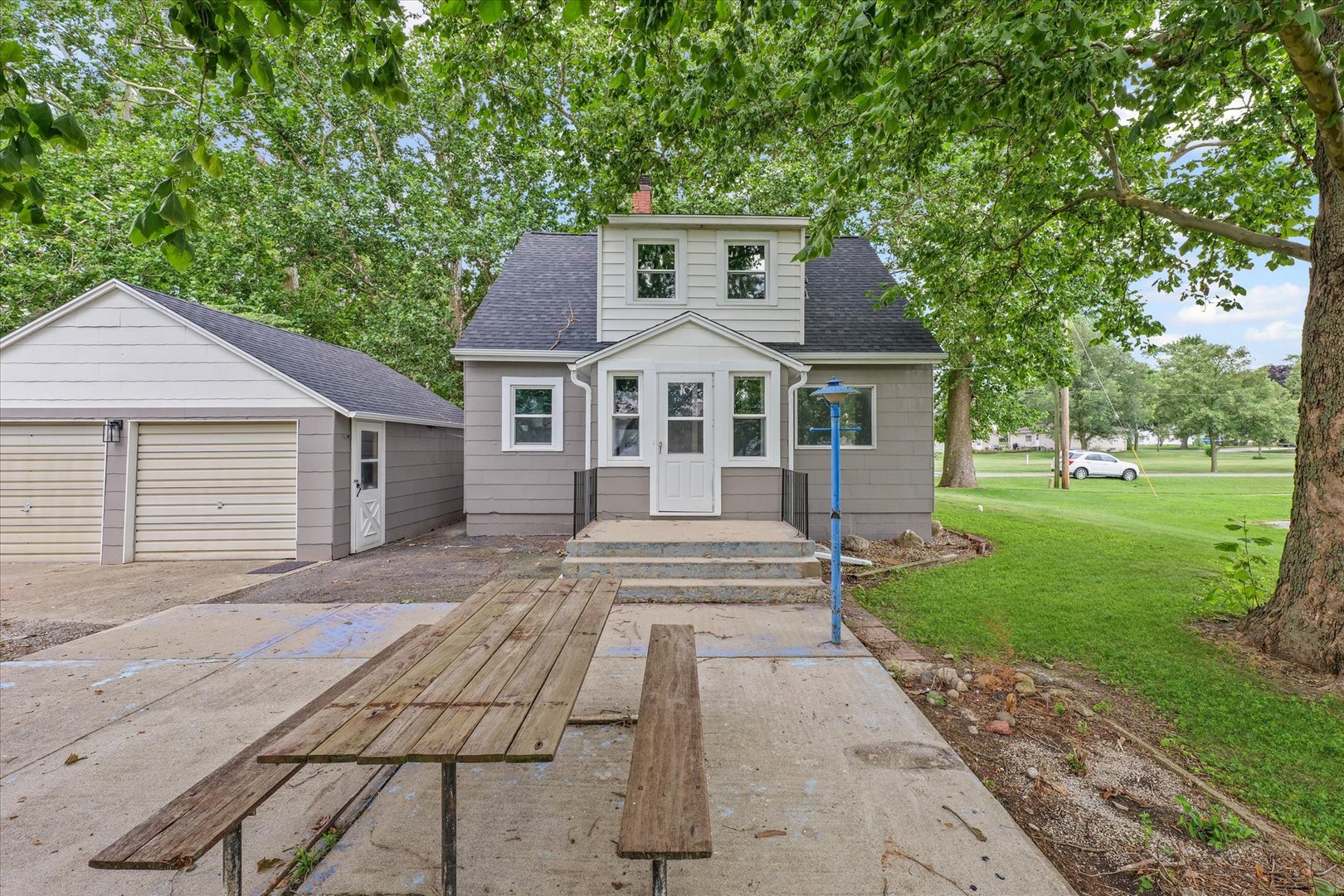 105 Madison Street Sibley, IL 61773 - Photo 2 of 22 a front view of a house with a yard