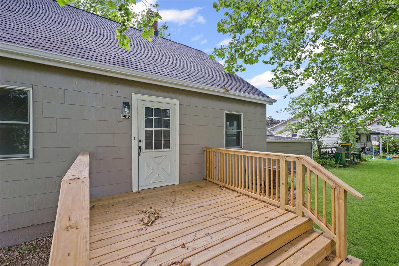 105 Madison Street Sibley, IL 61773 - Photo 21 of 22 a view of a house with a wooden deck