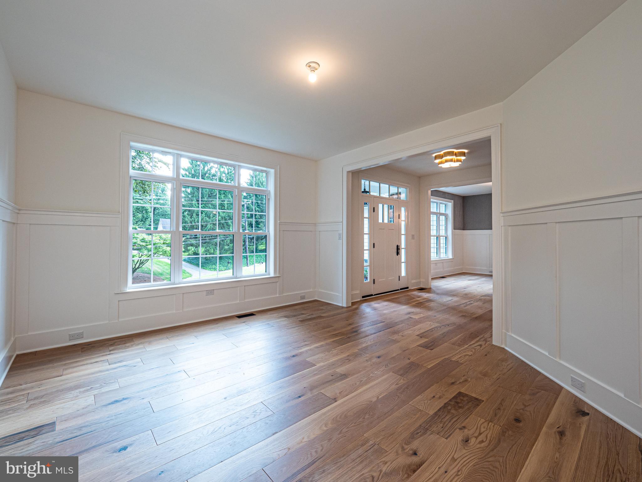 2 Timber Mill Lane, Unit SERENO Landenberg, PA 19350 - Photo 4 of 62 an empty room with wooden floor and windows