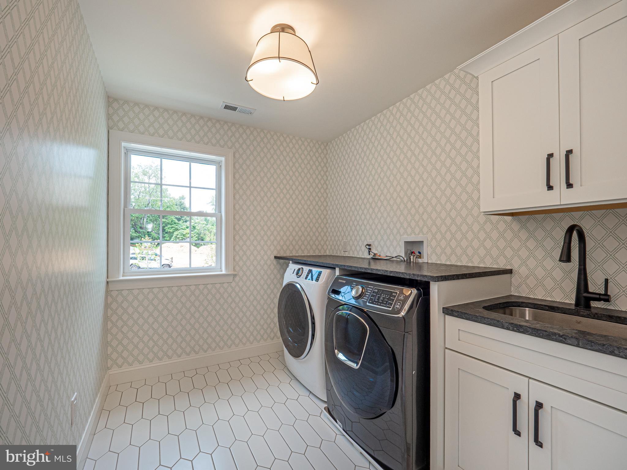 2 Timber Mill Lane, Unit SERENO Landenberg, PA 19350 - Photo 53 of 62 a utility room with sink dryer and washer