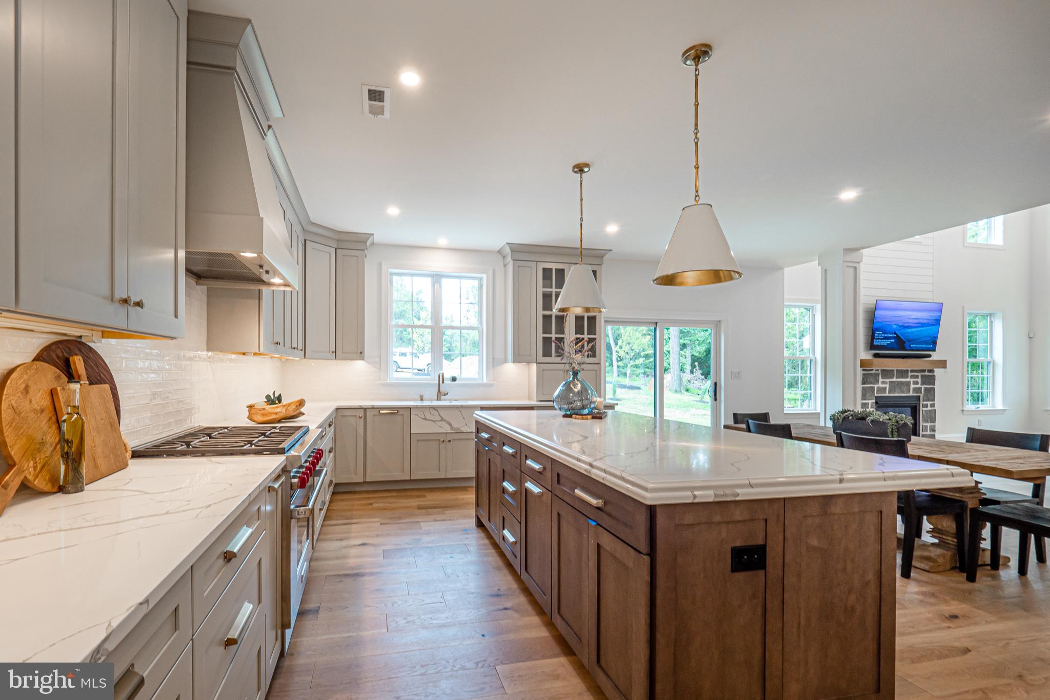 2 Timber Mill Lane, Unit SERENO Landenberg, PA 19350 - Photo 9 of 62 a kitchen with stainless steel appliances granite countertop a sink and a wooden floors