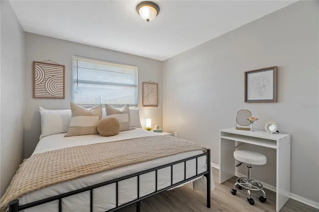 a bedroom with a bed and a table in it